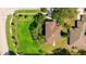 Aerial view of a house showing the roof, the surrounding trees and lawns and the neighborhood streets at 3303 Pine Top Dr, Valrico, FL 33594