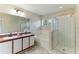 Bathroom showcasing dual sinks, soaking tub, separate shower, and tile floors at 3303 Pine Top Dr, Valrico, FL 33594