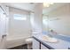 Cozy bathroom featuring a shower and tub combo, toilet, and a single sink vanity at 3303 Pine Top Dr, Valrico, FL 33594