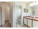 Bathroom featuring dual sinks and tile floors as well as a water closet and walk-in closet at 3303 Pine Top Dr, Valrico, FL 33594
