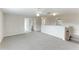 Upstairs bonus room offers neutral carpet, ample space, and natural light at 3303 Pine Top Dr, Valrico, FL 33594