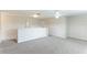 Bonus room with neutral paint and carpet, ceiling fan, and lots of natural light at 3303 Pine Top Dr, Valrico, FL 33594