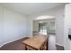 Open dining area with wood floors and view to the outside through sliding glass doors at 3303 Pine Top Dr, Valrico, FL 33594