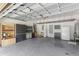 Spacious garage featuring cabinets for storage, a refrigerator, and utility sink at 3303 Pine Top Dr, Valrico, FL 33594