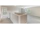Second floor hallway with neutral paint and carpet and open view of the bonus room at 3303 Pine Top Dr, Valrico, FL 33594
