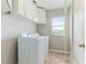 Bright laundry room featuring a washer and dryer and white cabinetry at 3303 Pine Top Dr, Valrico, FL 33594