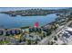Stunning aerial view of waterfront condos featuring a pool and marina, promising a resort-style experience at 3540 Gulf Of Mexico Dr # 303, Longboat Key, FL 34228