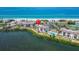 Aerial view of beachfront condo and community featuring private beach access and pool at 3540 Gulf Of Mexico Dr # 303, Longboat Key, FL 34228