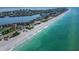 Beautiful aerial view of the beach and shoreline, highlighting the turquoise ocean water at 3540 Gulf Of Mexico Dr # 303, Longboat Key, FL 34228