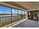 Unwind on the screened balcony with captivating waterfront views and a refreshing breeze at 3540 Gulf Of Mexico Dr # 303, Longboat Key, FL 34228