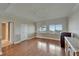 Bedroom with wood floors, wide windows with shutters, and large closets at 3540 Gulf Of Mexico Dr # 303, Longboat Key, FL 34228