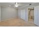 Bedroom with carpet, ceiling fan and large closet at 3540 Gulf Of Mexico Dr # 303, Longboat Key, FL 34228