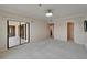 Expansive bedroom with neutral walls, carpeting, and a sliding glass door leading to a balcony at 3540 Gulf Of Mexico Dr # 303, Longboat Key, FL 34228