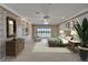 Main bedroom featuring water view, crown molding, and ensuite bathroom at 3540 Gulf Of Mexico Dr # 303, Longboat Key, FL 34228