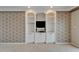 Bedroom boasts built-in shelves and storage with TV at 3540 Gulf Of Mexico Dr # 303, Longboat Key, FL 34228