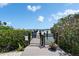 Residents-only dock with gated access, providing a secure and scenic gateway to waterfront activities at 3540 Gulf Of Mexico Dr # 303, Longboat Key, FL 34228