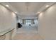 Open foyer leading to a spacious living area with water view, enhanced by elegant decor at 3540 Gulf Of Mexico Dr # 303, Longboat Key, FL 34228