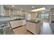 Kitchen features tile flooring, black granite counters, and bright white cabinets at 3540 Gulf Of Mexico Dr # 303, Longboat Key, FL 34228