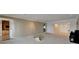 Open living room space with neutral tones and ample natural light from front door at 3540 Gulf Of Mexico Dr # 303, Longboat Key, FL 34228