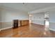 Spacious living room with wood floors, crown molding, and neutral paint at 3540 Gulf Of Mexico Dr # 303, Longboat Key, FL 34228