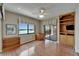 Inviting interior with water views, built-in shelving, and ample natural light from large window at 3540 Gulf Of Mexico Dr # 303, Longboat Key, FL 34228