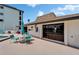 Outdoor seating area next to the community pool with umbrellas for shade at 3540 Gulf Of Mexico Dr # 303, Longboat Key, FL 34228