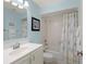 Bright bathroom with single vanity, shower-tub combo, and updated fixtures at 3627 Longmeadow # 39, Sarasota, FL 34235