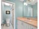 Well-lit bathroom features a peach vanity top and a shower with a sliding glass door at 3627 Longmeadow # 39, Sarasota, FL 34235