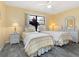 Charming bedroom with twin beds, wicker furniture, and a ceiling fan for added comfort at 3627 Longmeadow # 39, Sarasota, FL 34235