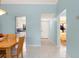 Bright interior featuring tile flooring, an open layout, and views into the kitchen and bedroom at 3627 Longmeadow # 39, Sarasota, FL 34235