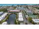 Aerial view of coastal townhouses near the waterfront and a picturesque beach at 3803 E Bay Dr # 10, Bradenton Beach, FL 34217