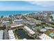 An aerial perspective shows beautiful beach condos with convenient access to nearby beaches and shopping areas at 3803 E Bay Dr # 10, Bradenton Beach, FL 34217
