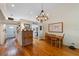 Charming dining room with hardwood floors and unique chandelier lighting at 3803 E Bay Dr # 10, Bradenton Beach, FL 34217