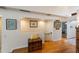 Hallway with hardwood floors and a peek into another room at 3803 E Bay Dr # 10, Bradenton Beach, FL 34217