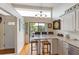 Eat-in kitchen with an undermount sink and a large window with views of mature landscaping at 3803 E Bay Dr # 10, Bradenton Beach, FL 34217