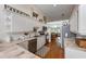 Eat-in kitchen featuring stainless appliances, quartz countertops, and hardwood flooring at 3803 E Bay Dr # 10, Bradenton Beach, FL 34217