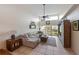 Spacious living room with high ceilings, cozy sectional, and outdoor views at 3803 E Bay Dr # 10, Bradenton Beach, FL 34217