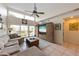 Bright living room featuring a sectional sofa and an entertainment center at 3803 E Bay Dr # 10, Bradenton Beach, FL 34217