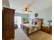 Comfortable main bedroom featuring a ceiling fan and dresser at 3803 E Bay Dr # 10, Bradenton Beach, FL 34217