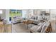 Comfortable living room with sliding glass doors to the outside, neutral tones, and modern furniture at 416 Delaney St, Port Charlotte, FL 33954