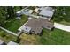 Aerial view of a home with a fenced backyard and swimming pool at 417 20Th W Ave, Palmetto, FL 34221