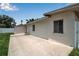 The backyard includes a concrete patio area and a view of the house, providing a versatile outdoor space at 417 20Th W Ave, Palmetto, FL 34221