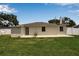 Spacious backyard featuring a cozy patio for relaxation and outdoor entertainment, adding a touch of serenity at 417 20Th W Ave, Palmetto, FL 34221