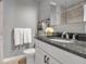 Bathroom featuring granite countertops, a modern sink, and decorative rustic towel rack at 417 20Th W Ave, Palmetto, FL 34221