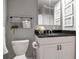 Bathroom featuring granite countertops, a modern sink, and decorative rustic towel rack at 417 20Th W Ave, Palmetto, FL 34221