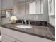 Bathroom featuring granite countertops, a modern sink, and decorative fixtures at 417 20Th W Ave, Palmetto, FL 34221
