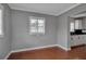 Cozy dining area featuring hardwood floors, crown molding, and natural light from an adjacent window at 417 20Th W Ave, Palmetto, FL 34221