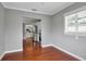 Cozy dining area features hardwood floors, crown molding, and an open view to the kitchen beyond at 417 20Th W Ave, Palmetto, FL 34221