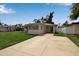 Charming single-story home featuring neutral stucco siding, well-maintained front lawn, and long driveway at 417 20Th W Ave, Palmetto, FL 34221