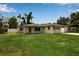 Lovely single-story home with white siding, shutters, well-kept lawn, and fenced yard for privacy at 417 20Th W Ave, Palmetto, FL 34221